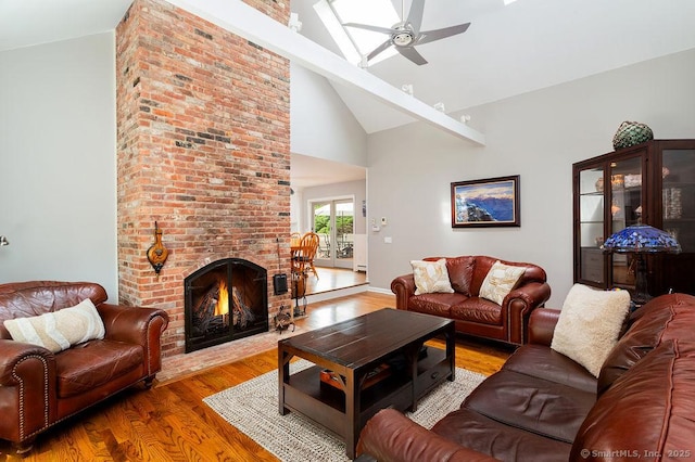 12 Fawn Ridge Dr, Brookfield, CT 06804 - living area featuring a ceiling fan, wood finished floors, high vaulted ceiling, and a brick fireplace