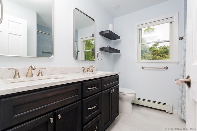 12 Fawn Ridge Dr, Brookfield, CT 06804 - bathroom with a baseboard radiator, double vanity, toilet, and a shower