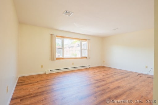 188 Judith Ln, Waterbury, CT 06704 - unfurnished room with baseboard heating, wood finished floors, and baseboards