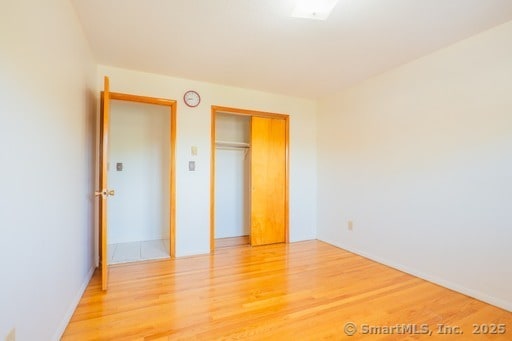 188 Judith Ln, Waterbury, CT 06704 - unfurnished bedroom with light wood-style flooring and a closet