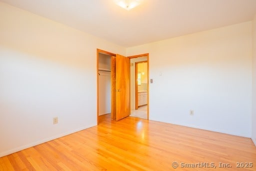 188 Judith Ln, Waterbury, CT 06704 - unfurnished bedroom with light wood-type flooring and a closet
