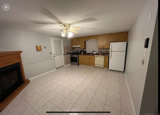 188 Judith Ln, Waterbury, CT 06704 - kitchen featuring white appliances, dark countertops, under cabinet range hood, a sink, and a ceiling fan