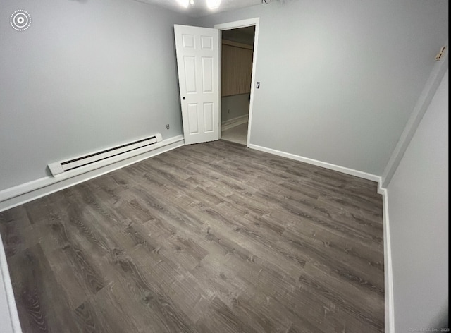 188 Judith Ln, Waterbury, CT 06704 - unfurnished bedroom with baseboard heating, wood finished floors, and baseboards