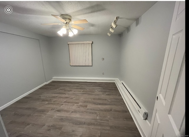 188 Judith Ln, Waterbury, CT 06704 - unfurnished room with a baseboard heating unit, a textured ceiling, ceiling fan, wood finished floors, and baseboards