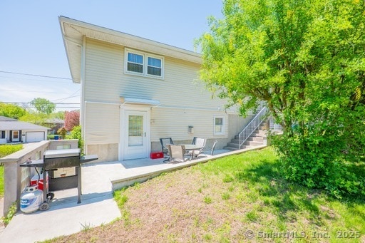 188 Judith Ln, Waterbury, CT 06704 - back of house with a patio area and a yard