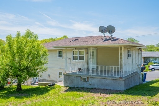 188 Judith Ln, Waterbury, CT 06704 - rear view of property with a porch and a lawn