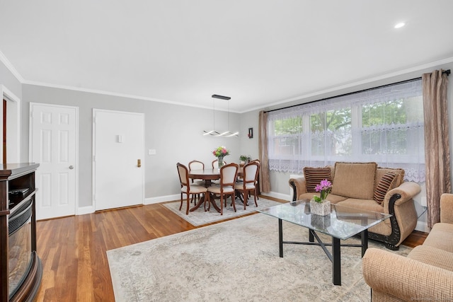 32 Courtland Ave, Stamford, CT 06902 - living area with crown molding, baseboards, and wood finished floors