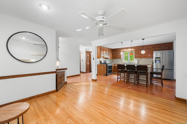 80 Farmstead Ln, Windsor, CT 06095 - living area featuring light wood-style flooring, baseboards, and a ceiling fan