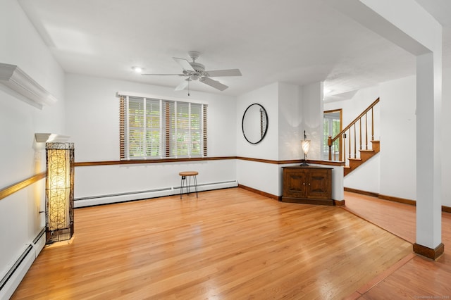 80 Farmstead Ln, Windsor, CT 06095 - spare room with a baseboard radiator, a ceiling fan, wood finished floors, and stairs