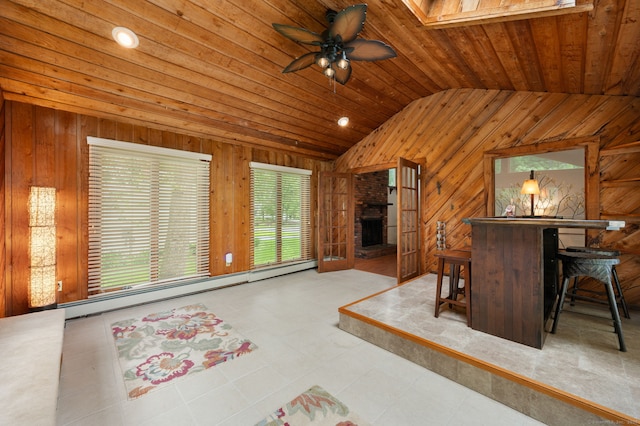 80 Farmstead Ln, Windsor, CT 06095 - unfurnished living room featuring vaulted ceiling, wood walls, a large fireplace, a baseboard heating unit, and ceiling fan