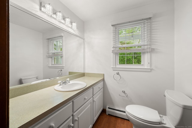 80 Farmstead Ln, Windsor, CT 06095 - bathroom with toilet, baseboard heating, vanity, and wood finished floors