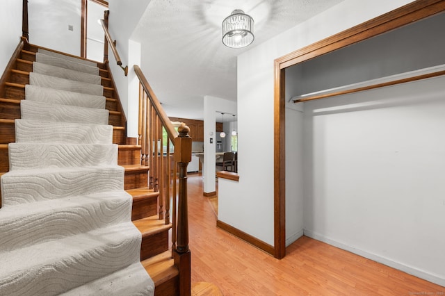 80 Farmstead Ln, Windsor, CT 06095 - staircase with wood finished floors and baseboards