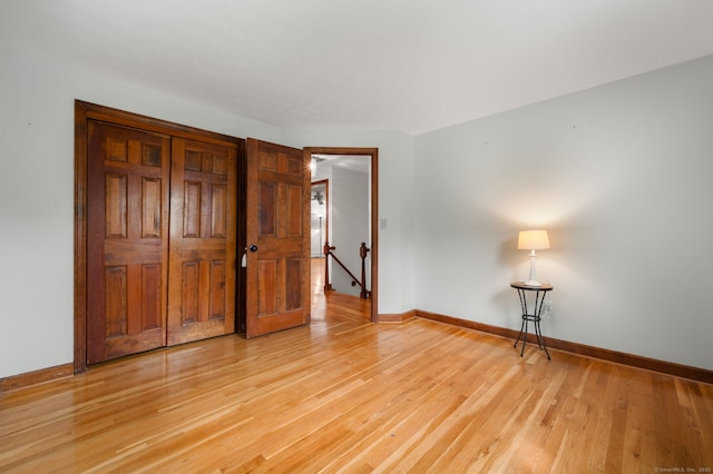 80 Farmstead Ln, Windsor, CT 06095 - unfurnished bedroom featuring baseboards, light wood-type flooring, and a closet