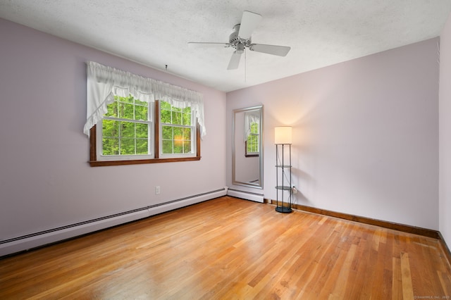 80 Farmstead Ln, Windsor, CT 06095 - empty room featuring baseboard heating, hardwood / wood-style floors, baseboards, ceiling fan, and a textured ceiling