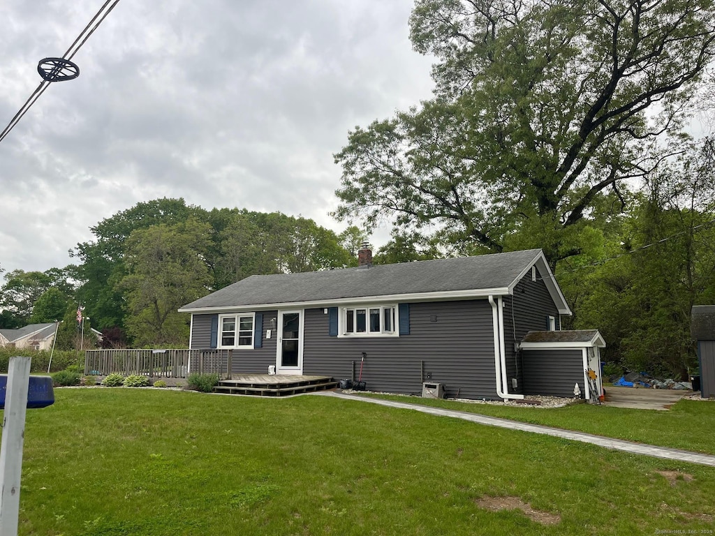 10 Schanck Rd, East Windsor, CT 06016 - ranch-style home with a chimney, a front yard, and a wooden deck