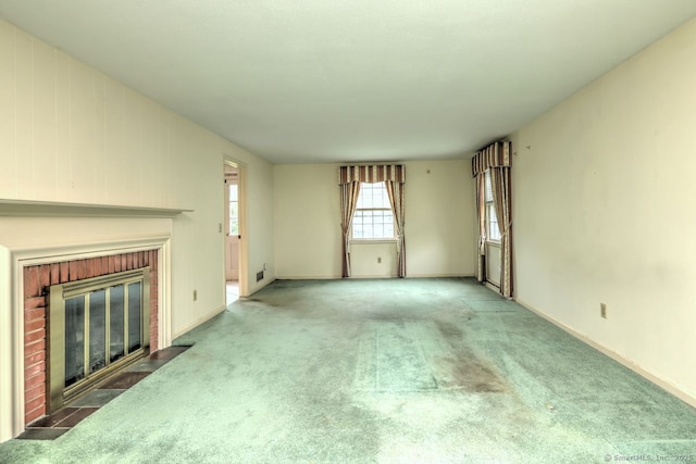 423 Baldwin Ave, Meriden, CT 06450 - unfurnished living room featuring a brick fireplace, carpet floors, and baseboards