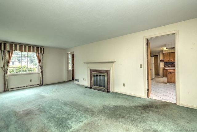 423 Baldwin Ave, Meriden, CT 06450 - unfurnished living room featuring baseboard heating, carpet floors, a brick fireplace, and baseboards