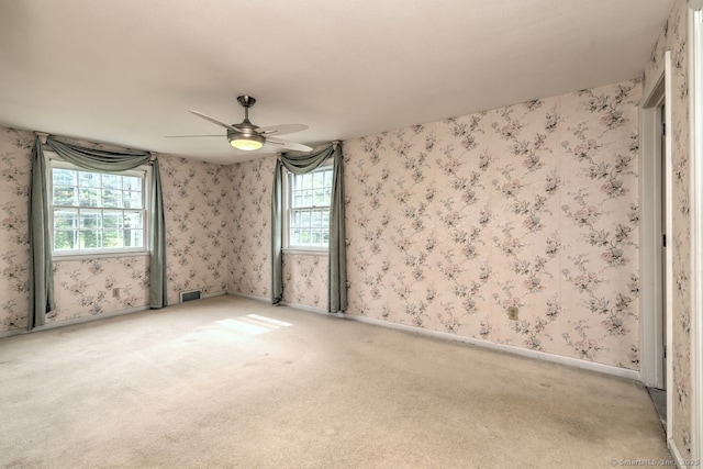 423 Baldwin Ave, Meriden, CT 06450 - spare room featuring carpet floors, ceiling fan, wallpapered walls, and baseboards