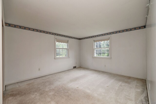423 Baldwin Ave, Meriden, CT 06450 - unfurnished room with healthy amount of natural light, carpet flooring, and baseboards