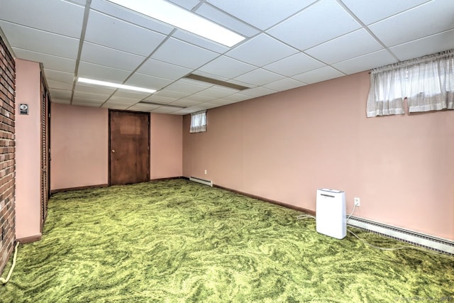 423 Baldwin Ave, Meriden, CT 06450 - basement featuring carpet floors, a baseboard heating unit, a baseboard radiator, baseboards, and a paneled ceiling