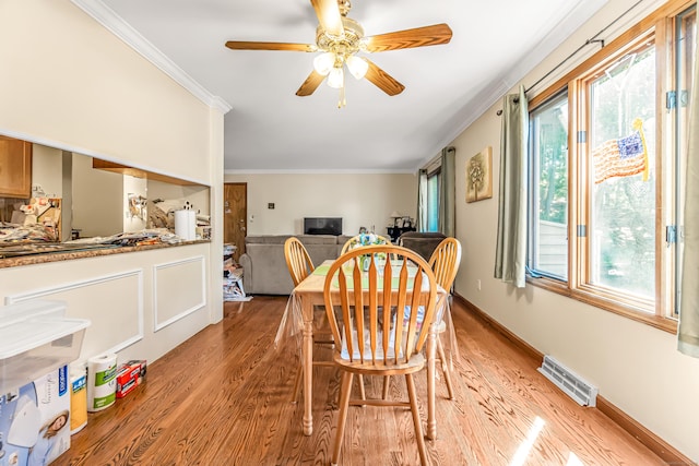 520 Vincellette St Unit C1, Bridgeport, CT 06606 - dining room with light wood-style floors, plenty of natural light, ornamental molding, and a ceiling fan