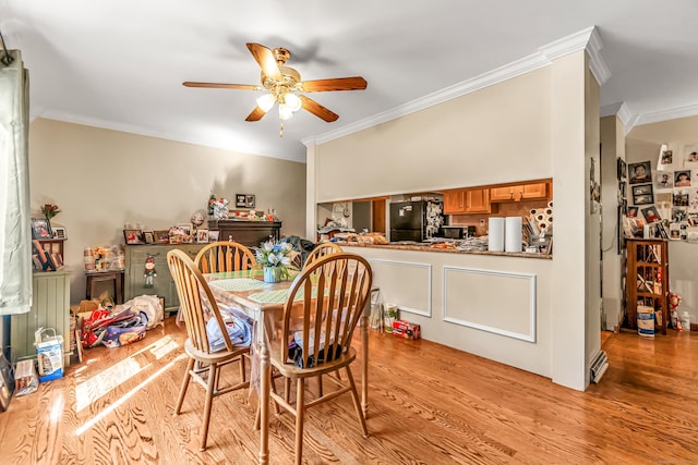 520 Vincellette St Unit C1, Bridgeport, CT 06606 - dining area with ornamental molding, a ceiling fan, and light wood finished floors