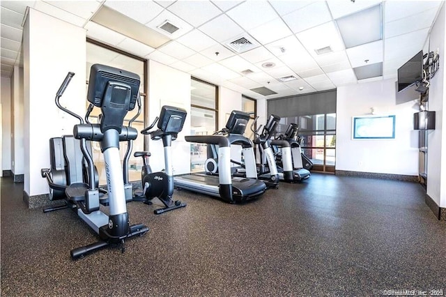 235 E River Dr Apt 502, East Hartford, CT 06108 - workout area featuring a drop ceiling and baseboards