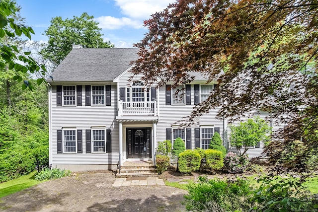 44 Oakmont Trl, Monroe, CT 06468 - view of front of property featuring a chimney, a balcony, and a shingled roof