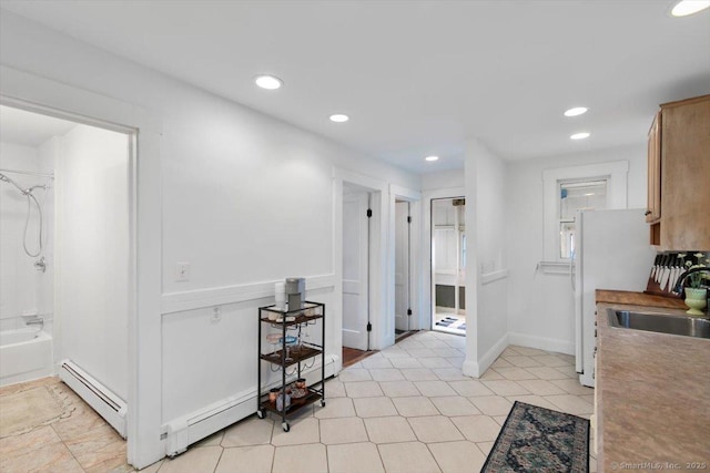 26 Shipyard Ln, Milford, CT 06460 - hallway with a sink, a baseboard radiator, recessed lighting, and baseboards