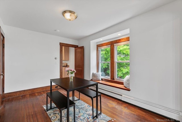 26 Shipyard Ln, Milford, CT 06460 - dining room featuring baseboard heating, wood finished floors, and baseboards