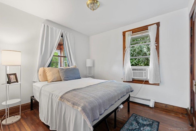 26 Shipyard Ln, Milford, CT 06460 - bedroom featuring a baseboard heating unit, cooling unit, wood finished floors, and baseboards