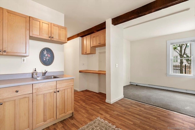 26 Shipyard Ln, Milford, CT 06460 - kitchen with a sink, light brown cabinets, wood finished floors, beamed ceiling, and light countertops