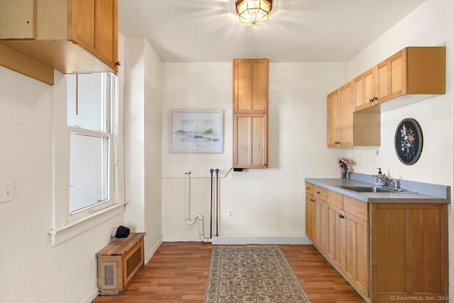 26 Shipyard Ln, Milford, CT 06460 - kitchen with a sink, wood finished floors, baseboards, and light brown cabinets