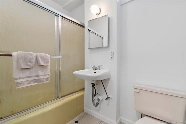 26 Shipyard Ln, Milford, CT 06460 - full bath with toilet, enclosed tub / shower combo, tile patterned floors, and baseboards