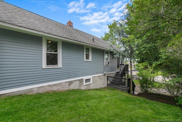 26 Shipyard Ln, Milford, CT 06460 - back of property with a yard, a chimney, and roof with shingles
