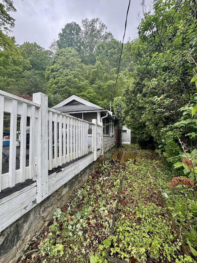 343 W Wakefield Blvd, Winchester, CT 06098 - view of side of home with a view of trees