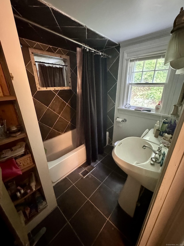 343 W Wakefield Blvd, Winchester, CT 06098 - bathroom featuring tile patterned flooring, shower / bath combo with shower curtain, and tile walls