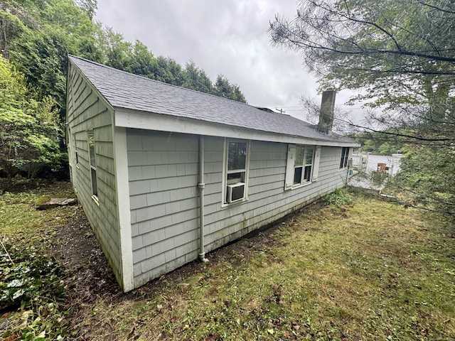 343 W Wakefield Blvd, Winchester, CT 06098 - view of property exterior with roof with shingles, a chimney, and cooling unit
