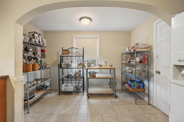 124 Jordan Ln, Wethersfield, CT 06109 - bar area featuring arched walkways and tile patterned floors