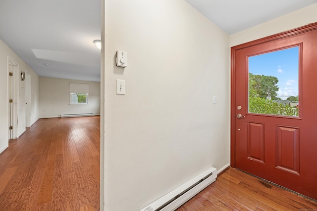 124 Jordan Ln, Wethersfield, CT 06109 - foyer featuring a baseboard radiator, wood finished floors, and baseboards