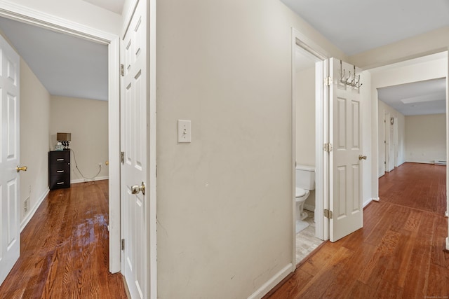 124 Jordan Ln, Wethersfield, CT 06109 - corridor with wood finished floors and baseboards