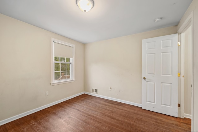124 Jordan Ln, Wethersfield, CT 06109 - empty room with wood finished floors, baseboards, and a smoke detector