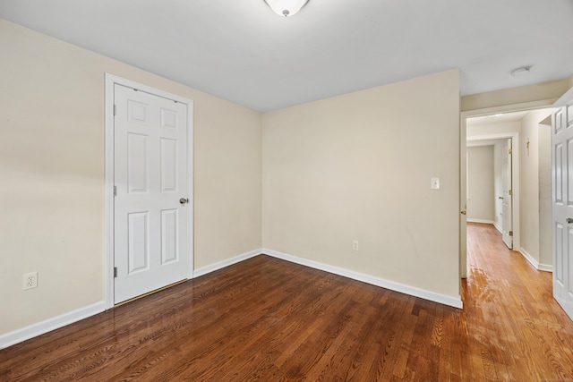 124 Jordan Ln, Wethersfield, CT 06109 - spare room with wood finished floors and baseboards