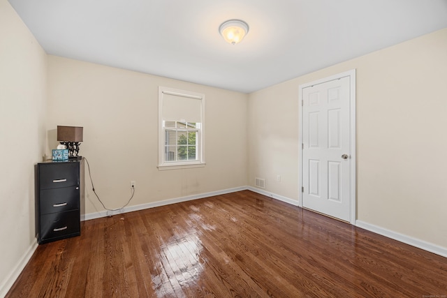 124 Jordan Ln, Wethersfield, CT 06109 - unfurnished bedroom with hardwood / wood-style flooring and baseboards