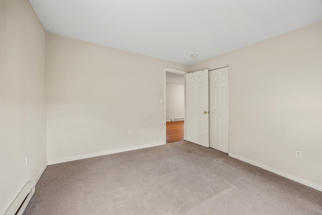 124 Jordan Ln, Wethersfield, CT 06109 - unfurnished bedroom featuring a baseboard heating unit, carpet floors, baseboards, baseboard heating, and a closet