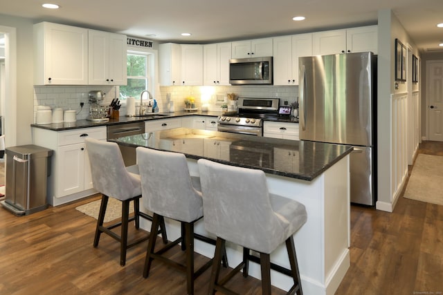 18 Totoket Rd, Waterford, CT 06375 - kitchen with appliances with stainless steel finishes, a sink, dark wood-style flooring, white cabinetry, and recessed lighting