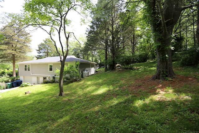 18 Totoket Rd, Waterford, CT 06375 - view of green lawn with an attached garage