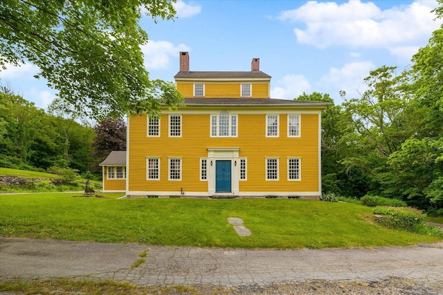 89 John Perry Rd, Eastford, CT 06242 - colonial home featuring a chimney, a front lawn, and entry steps