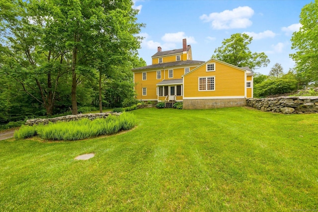 89 John Perry Rd, Eastford, CT 06242 - back of house with a chimney, a yard, and entry steps