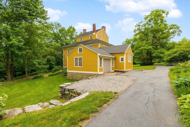 89 John Perry Rd, Eastford, CT 06242 - view of front facade with a garage, a front yard, driveway, and a chimney